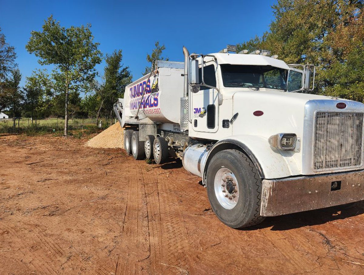 A Juniors Materials truck delivering decomposed granite.