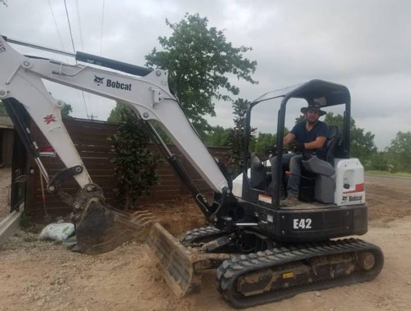 An excavator working on a Juniors Materials job.